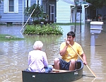 Woman Rescued from Flood Waters via Canoe
